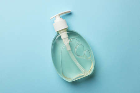 Bottle of liquid soap on light blue background, top viewの写真素材