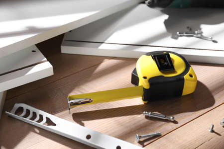 Furniture parts and equipment for self-assembly on wooden table