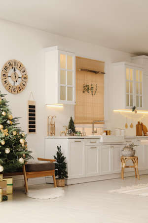 Cozy open plan kitchen decorated for Christmas. Interior designの写真素材