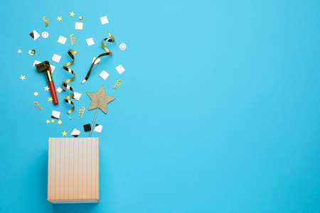 Flat lay composition with party items and box on light blue background, space for textの写真素材