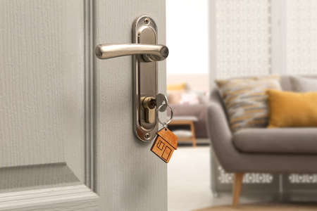 Close up view of door with key open in living roomの写真素材