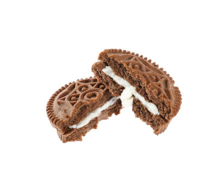 Broken tasty chocolate sandwich cookie with cream on white backgroundの写真素材