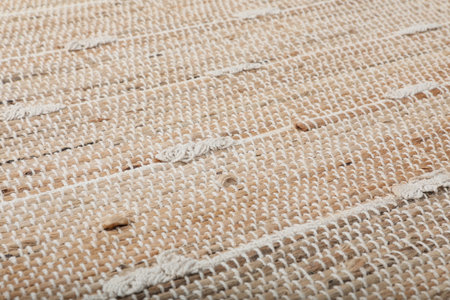 Stylish beige rug as background, closeup. interior accessories