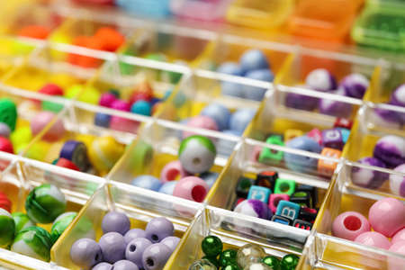 Organizer with variety of colorful beads as background, closeupの写真素材