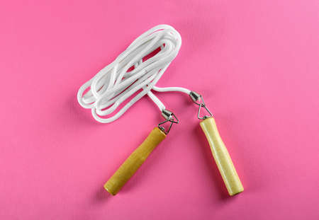 Skipping rope on pink background, top view. sports equipmentの写真素材