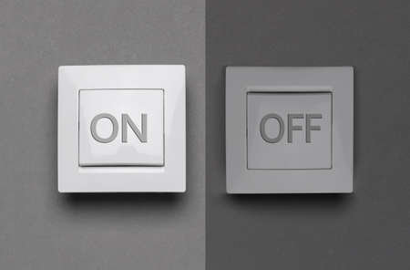 Turned ON and OFF light switches on gray background