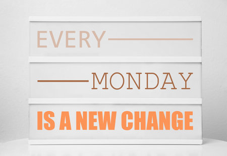 Lightbox with motivational quote Every Monday Is A New Change on white tableの写真素材