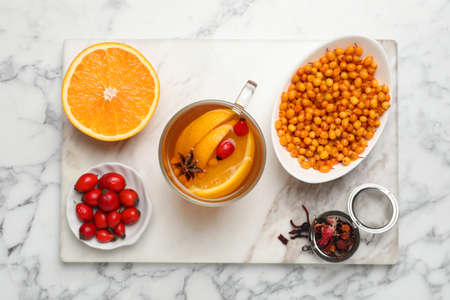 Immunity boosting drink and ingredients on white marble table, top viewの写真素材