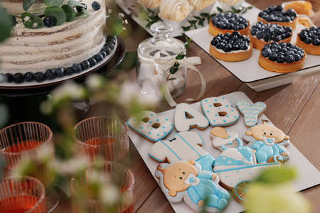 Beautiful cake and other treats on table. baby shower partyの写真素材
