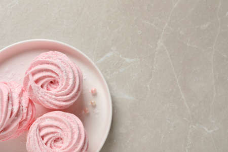 Delicious pink marshmallows on light gray table, top view. Space for textの写真素材