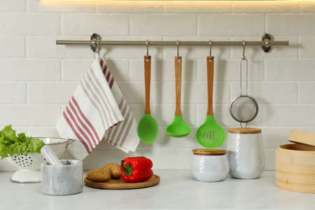 Countertop with different cooking utensils and products in kitchenの写真素材