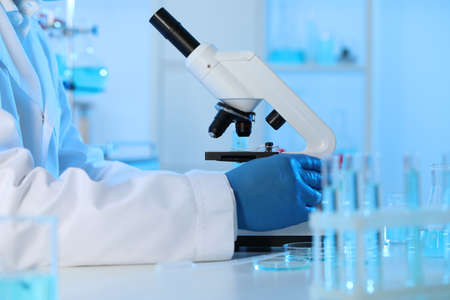 Scientist working with microscope in laboratory, closeup. Medical researchの写真素材