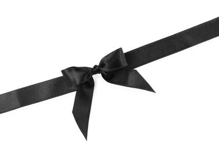Black satin ribbon with bow on white background, top viewの写真素材