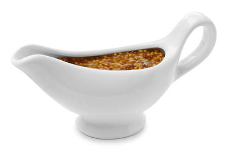 Ceramic boat with whole grain mustard sauce isolated on whiteの写真素材