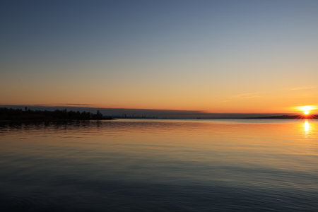 Picturesque view of beautiful riverside during sunsetの写真素材
