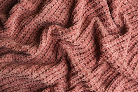 Beautiful pink knitted fabric as background, top viewの写真素材