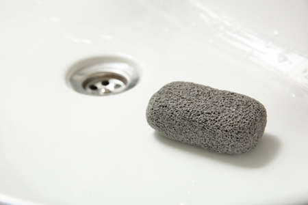 Pumice stone in sink, closeup. Space for textの写真素材