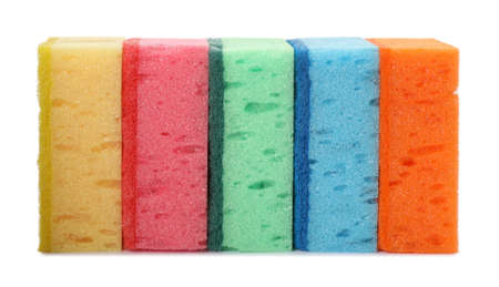 Bright cleaning sponges with abrasive scourers on white background