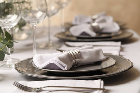 Stylish elegant table setting for festive dinner in restaurantの写真素材