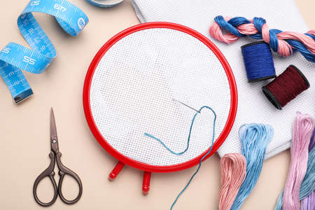 Flat lay composition with embroidery hoop on gray backgroundの写真素材