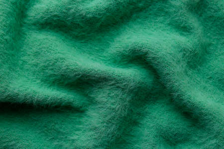 Beautiful green fabric as background, top viewの写真素材