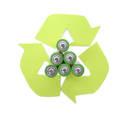 Used batteries and recycling symbol on white background, top viewの写真素材