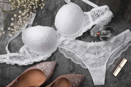 Flat lay composition with elegant white women's underwear on gray backgroundの写真素材