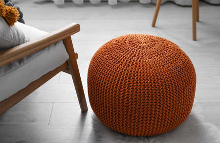 Stylish knitted pouf on floor in room. Interior designの写真素材