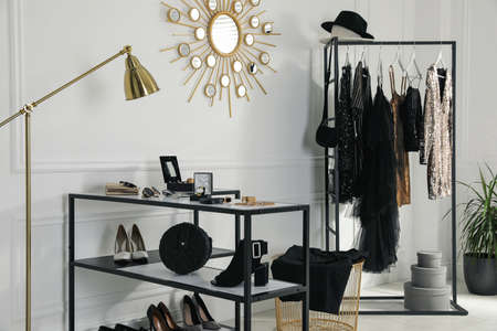 Stylish dressing room interior with trendy clothes and luxury accessoriesの写真素材