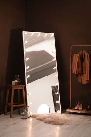 Stylish mirror with light bulbs in dressing room. interior designの写真素材