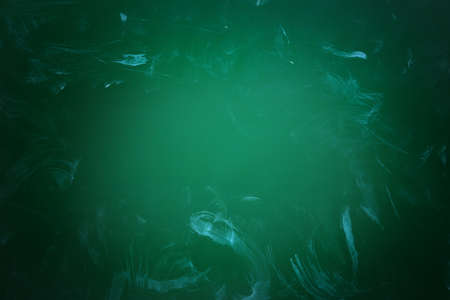 Dirty green chalkboard as background. Vignette effectの写真素材