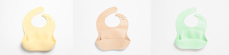 Set with different silicone baby bibs on white background, top view. banner designの写真素材
