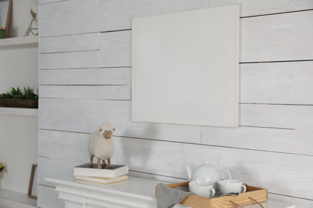 Stylish living room interior with empty canvas on white wooden wall. Mockup for designの写真素材