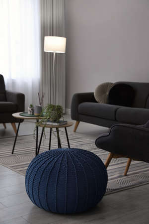 Stylish comfortable poufs and sofa in room. home design