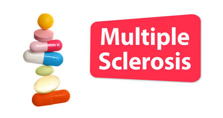 Multiple sclerosis treatment. Stack of different colorful pills on white background