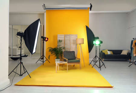 Stylish furniture in photo studio with professional equipmentの写真素材