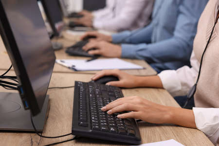 Call center operators working in office, closeup