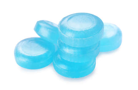 Many light blue cough drops on white backgroundの写真素材