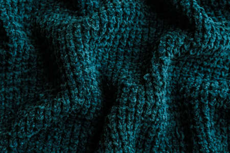 Beautiful dark knitted fabric as background, top viewの写真素材