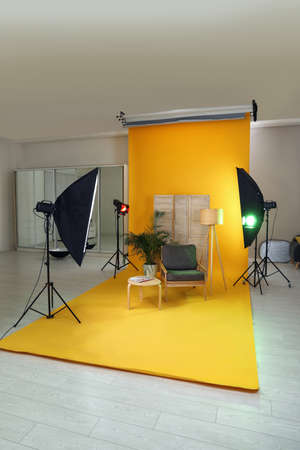 Stylish furniture in photo studio with professional equipmentの写真素材