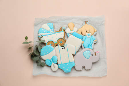 Set of baby shower cookies on light pink background, flat layの写真素材