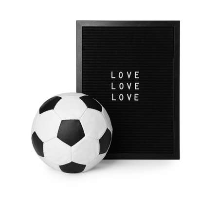 Soccer ball and letter board with words Love on white backgroundの写真素材