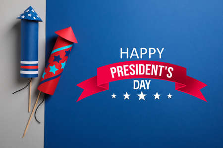 Happy President's Day - federal holiday. Firework rockets and text on color background, flat layの写真素材