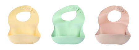 Set with different silicone baby bibs on white background, top view. banner designの写真素材