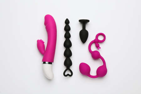 Sex toys on white background, flat lay
