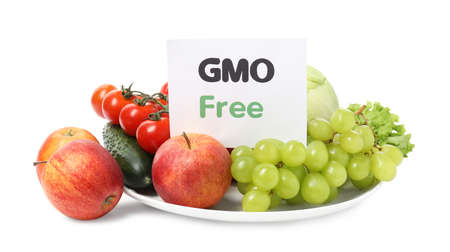 Fresh fruits, vegetables and card with text GMO Free on white backgroundの写真素材