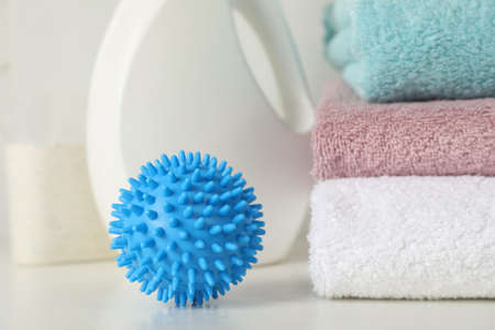 Dryer ball on white table, closeup. Space for textの写真素材