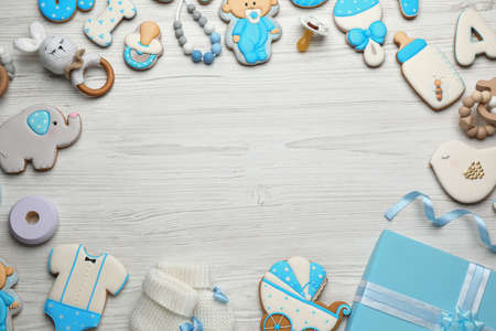 Frame made with cute tasty cookies of different shapes, flat lay and space for text. baby shower partyの写真素材