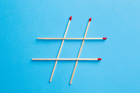 Hashtag symbol of matches on turquoise background, top viewの写真素材