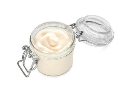 Mayonnaise in glass jar isolated on whiteの写真素材